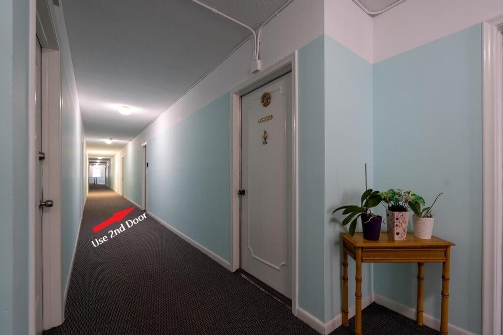 400 South Cypress Road, Unit 424 Pompano Beach, FL 33060 - Photo 27 of 40 a hallway with potted plant and stairs