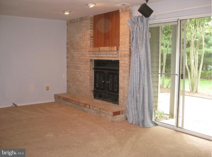 7375 Kindler Road Columbia, MD 21046 - Photo 11 of 27 a view of an empty room with windows & cabinet