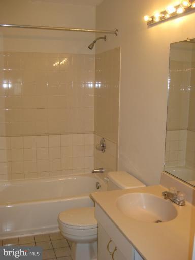 7375 Kindler Road Columbia, MD 21046 - Photo 18 of 27 a bathroom with a sink a toilet and shower