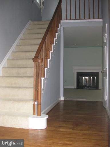 7375 Kindler Road Columbia, MD 21046 - Photo 3 of 27 a view of entryway and hall with wooden floor