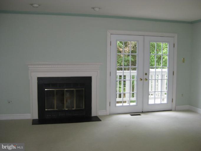 7375 Kindler Road Columbia, MD 21046 - Photo 25 of 27 a view of empty room with a fireplace