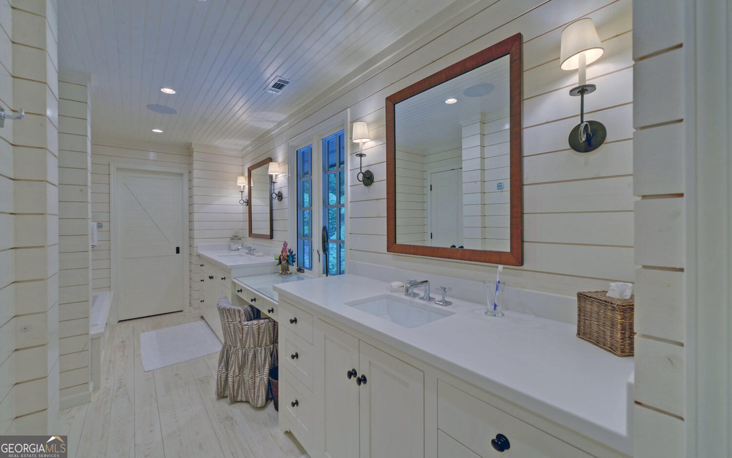 3540 Lake Rabun Road Lakemont, GA 30552 - Photo 42 of 81 a bathroom with a granite countertop sink a mirror and shower