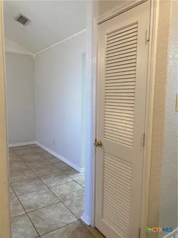 a view of a room with a white door