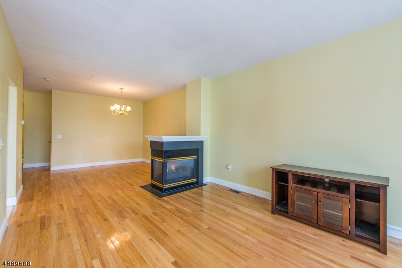 25 Buckingham Court Randolph, NJ 07869 - Photo 4 of 20 a view of empty room with wooden floor