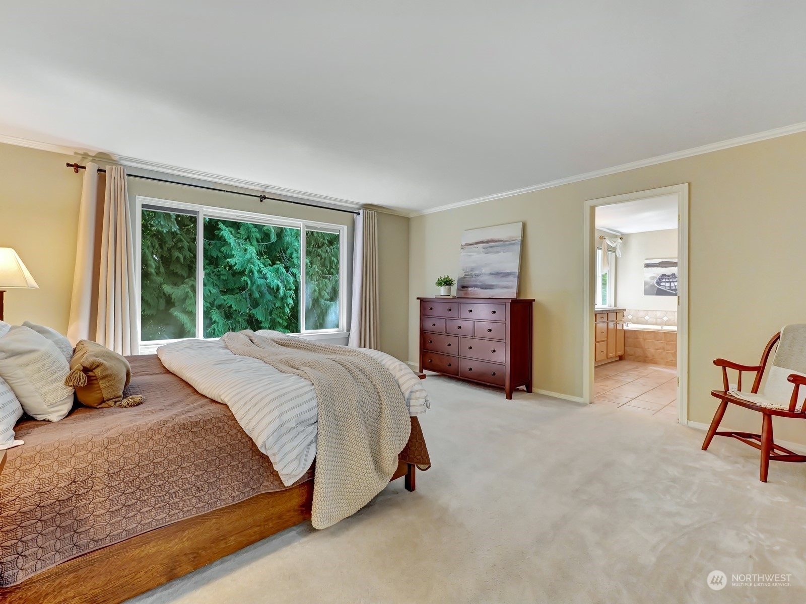 23927 30th Drive Southeast Bothell, WA 98021 - Photo 15 of 32 a bedroom with a bed and table chair