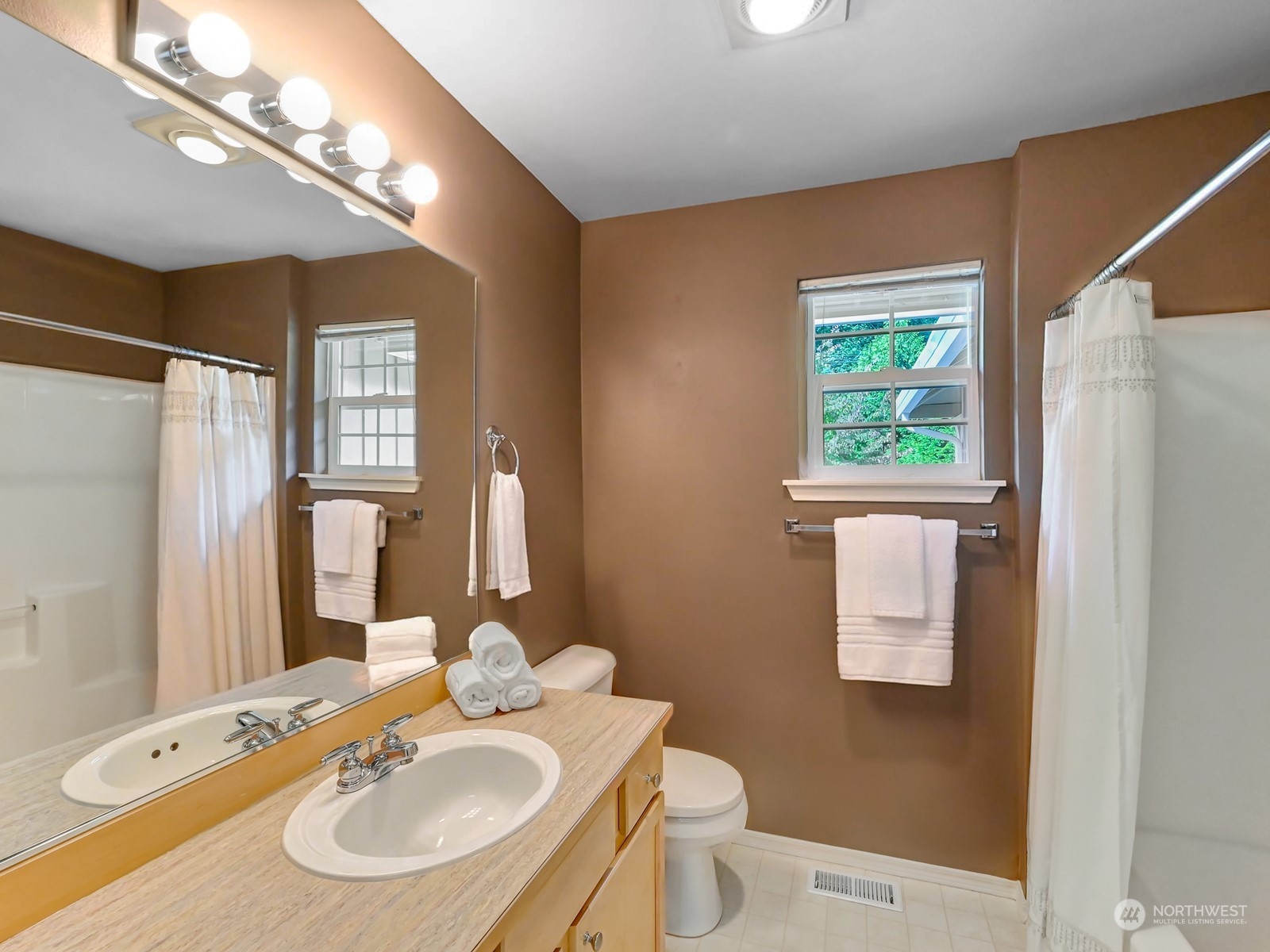 23927 30th Drive Southeast Bothell, WA 98021 - Photo 22 of 32 a bathroom with a sink and a mirror