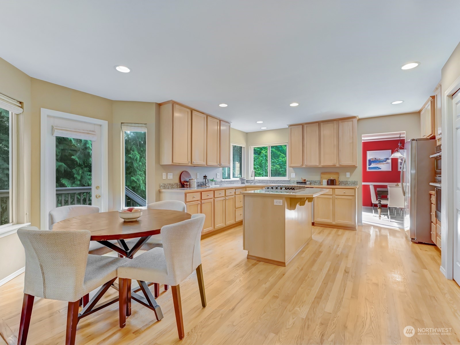 23927 30th Drive Southeast Bothell, WA 98021 - Photo 7 of 32 a kitchen with a table chairs refrigerator and cabinets
