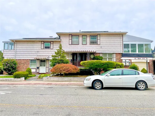 a car parked in front of a house