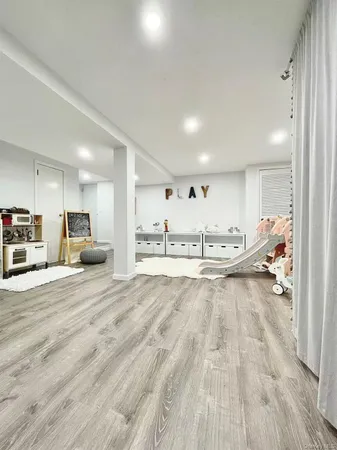 a view of a hallway with washer and dryer