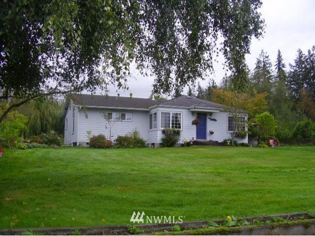 650 Parrish Road Sequim, WA 98382 - Photo 1 of 1 a front view of a house with a garden