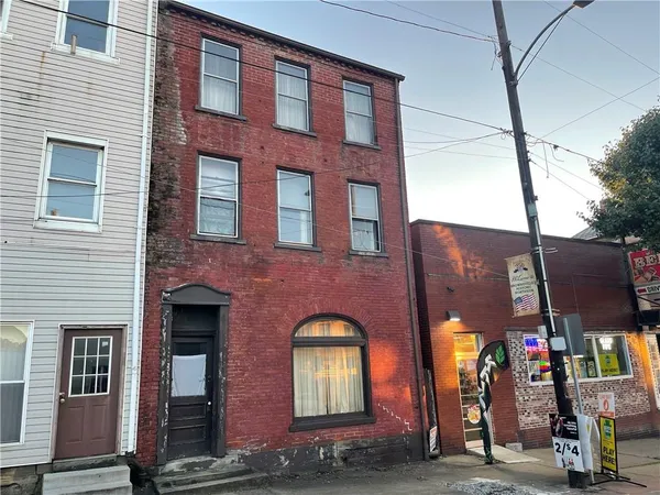 a front view of a building with street view