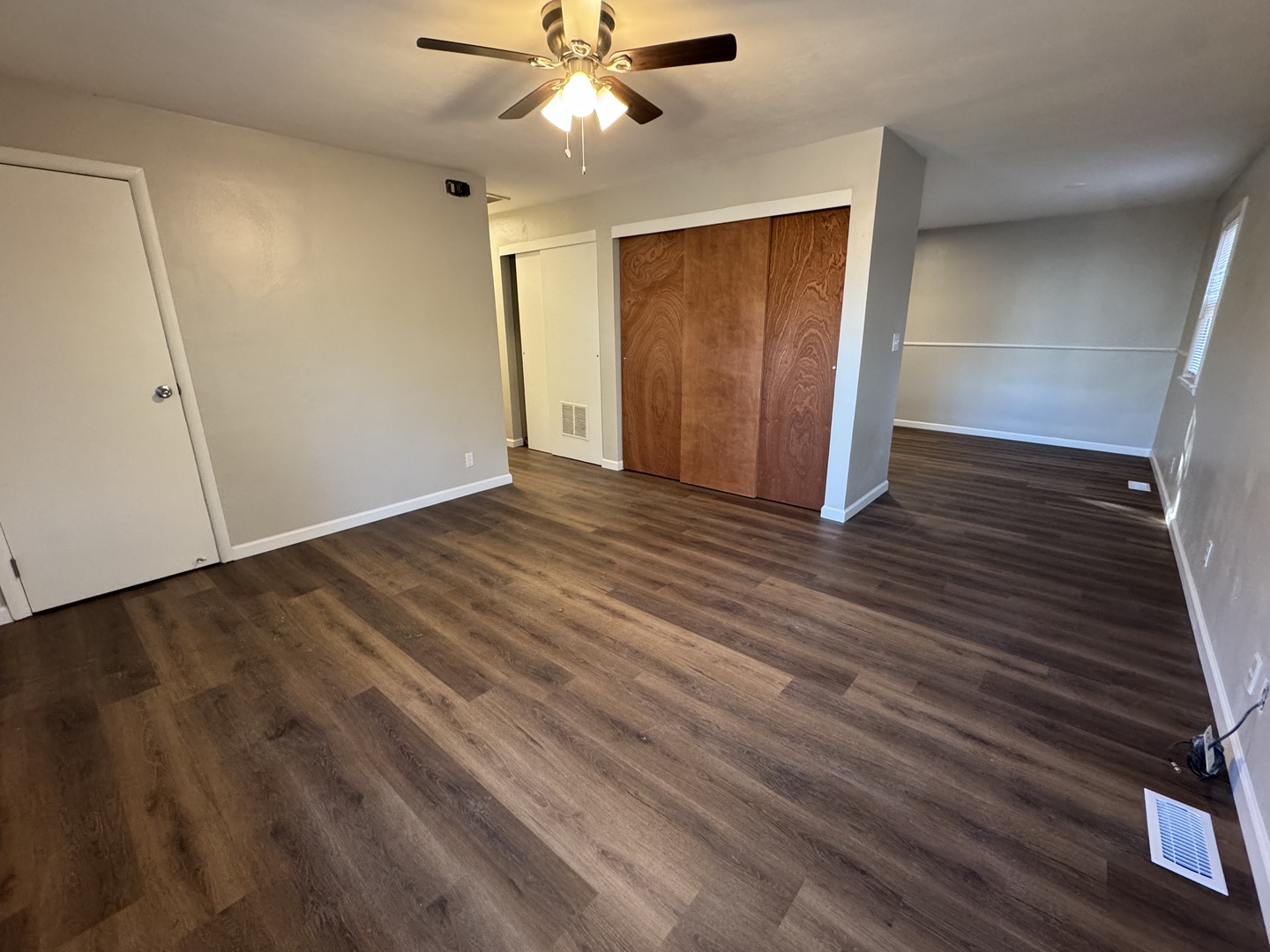 1605 Williamsburg Drive Champaign, IL 61821 - Photo 3 of 11 a view of an empty room with wooden floor