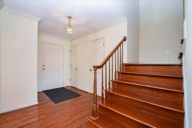 a view of an entryway with wooden floor