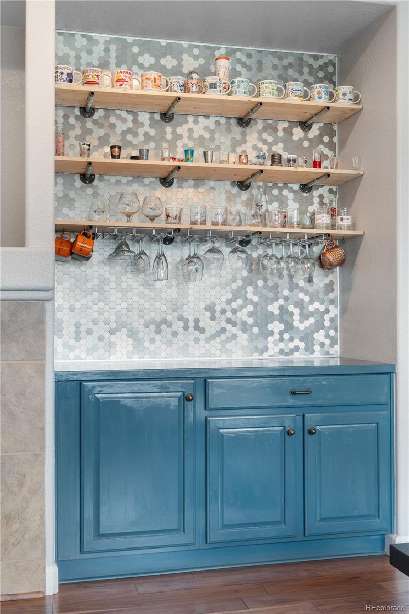 5839 Raleigh Circle Castle Rock, CO 80104 - Photo 15 of 35 a kitchen with a sink and cabinets