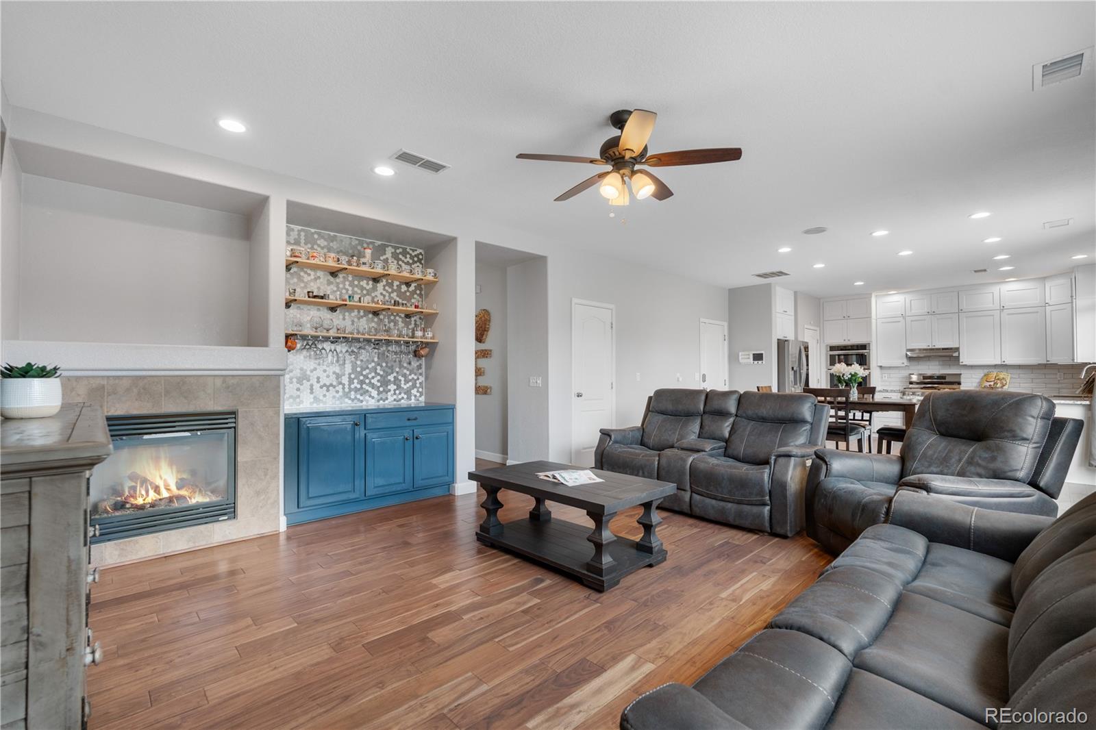 5839 Raleigh Circle Castle Rock, CO 80104 - Photo 17 of 35 a living room with furniture and a fireplace