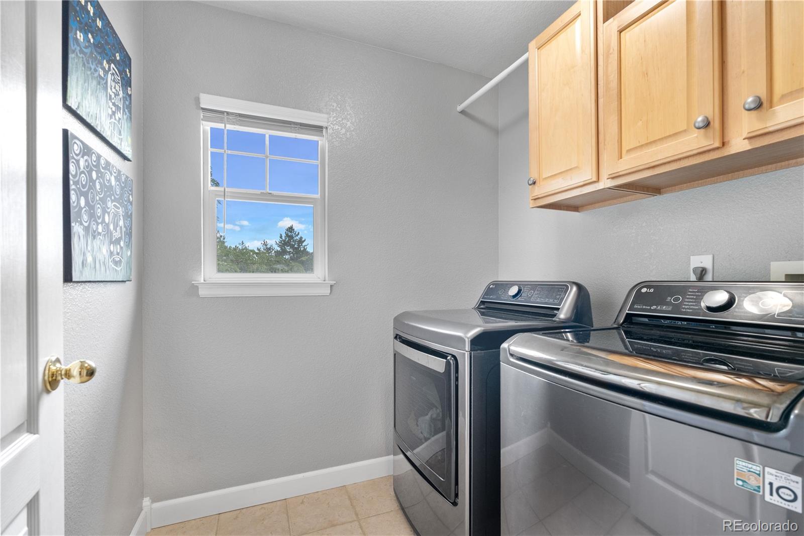 5839 Raleigh Circle Castle Rock, CO 80104 - Photo 28 of 35 a utility room with dryer and washer