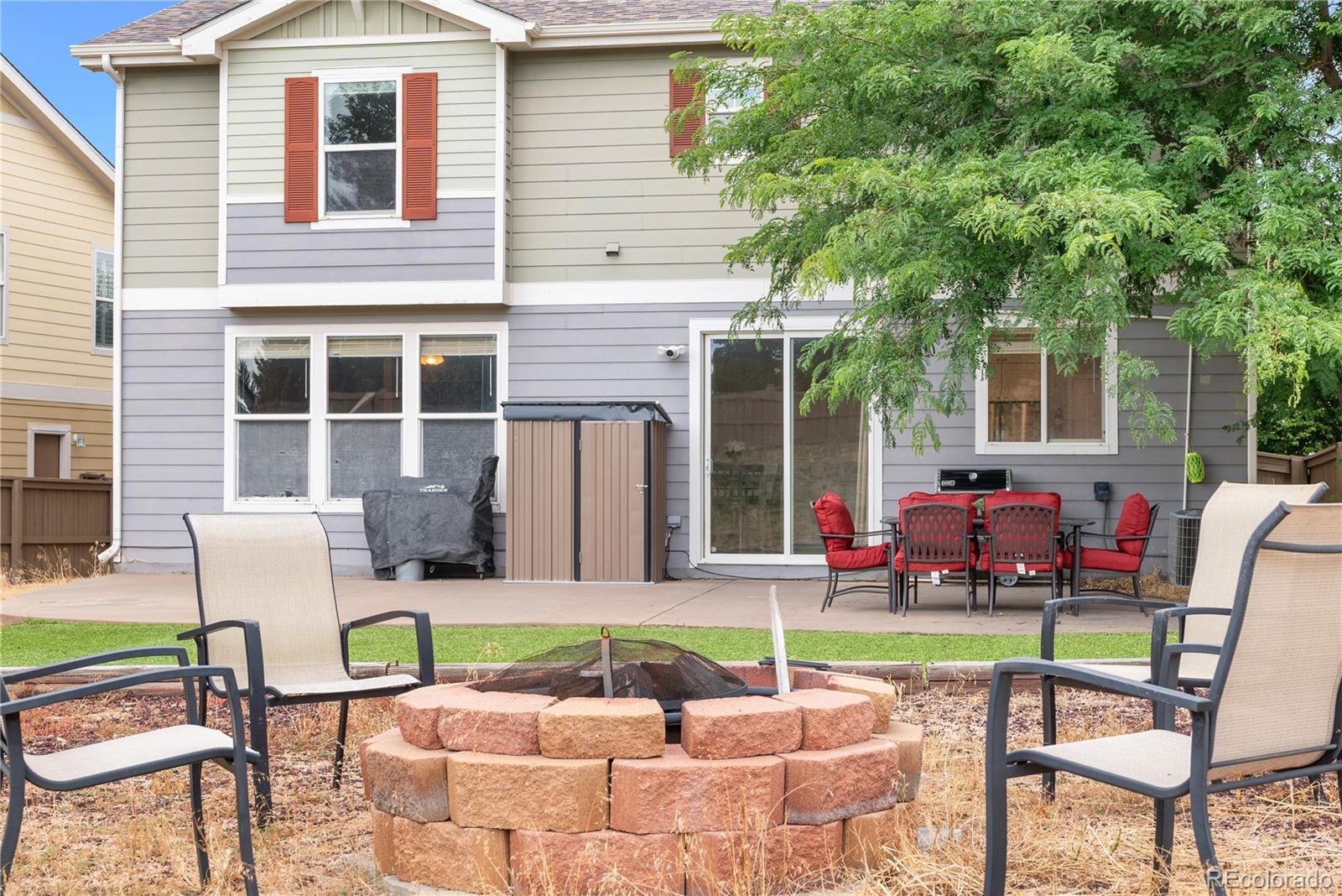 5839 Raleigh Circle Castle Rock, CO 80104 - Photo 3 of 35 a patio with a table and chairs