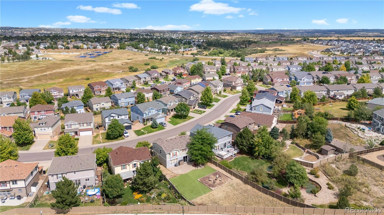 5839 Raleigh Circle Castle Rock, CO 80104 - Photo 6 of 35 an aerial view of ocean and residential houses with outdoor space