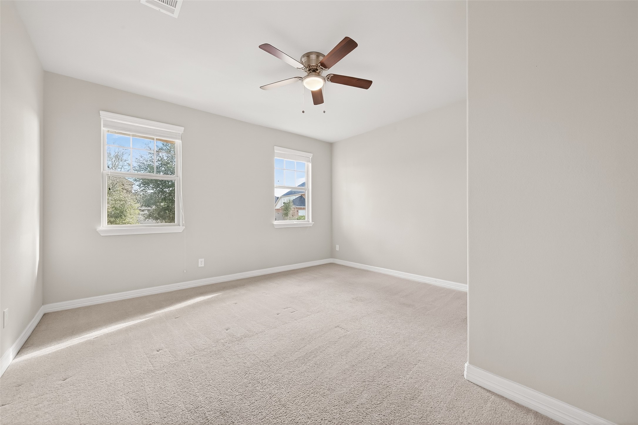 444 Round Lake Drive Rosenberg, TX 77469 - Photo 11 of 50 Guest bedroom 1, located on the front of the home.