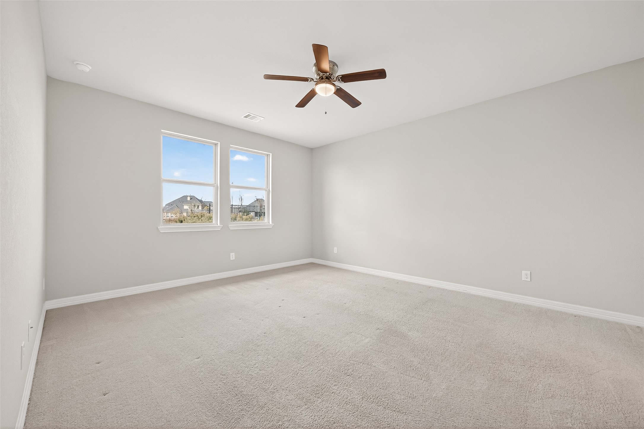 444 Round Lake Drive Rosenberg, TX 77469 - Photo 24 of 50 Large primary sits at the rear of the home with a window view of the backyard.