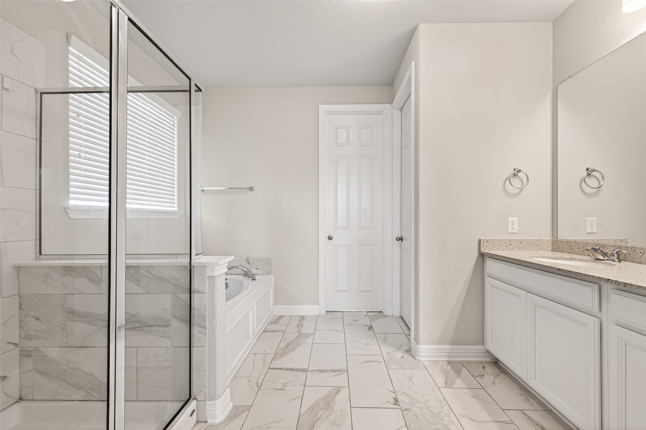 444 Round Lake Drive Rosenberg, TX 77469 - Photo 26 of 50 Private primary retreat offering double sinks, a soaking tub, and a sleek stand-up glass-enclosed shower for a spa-like experience