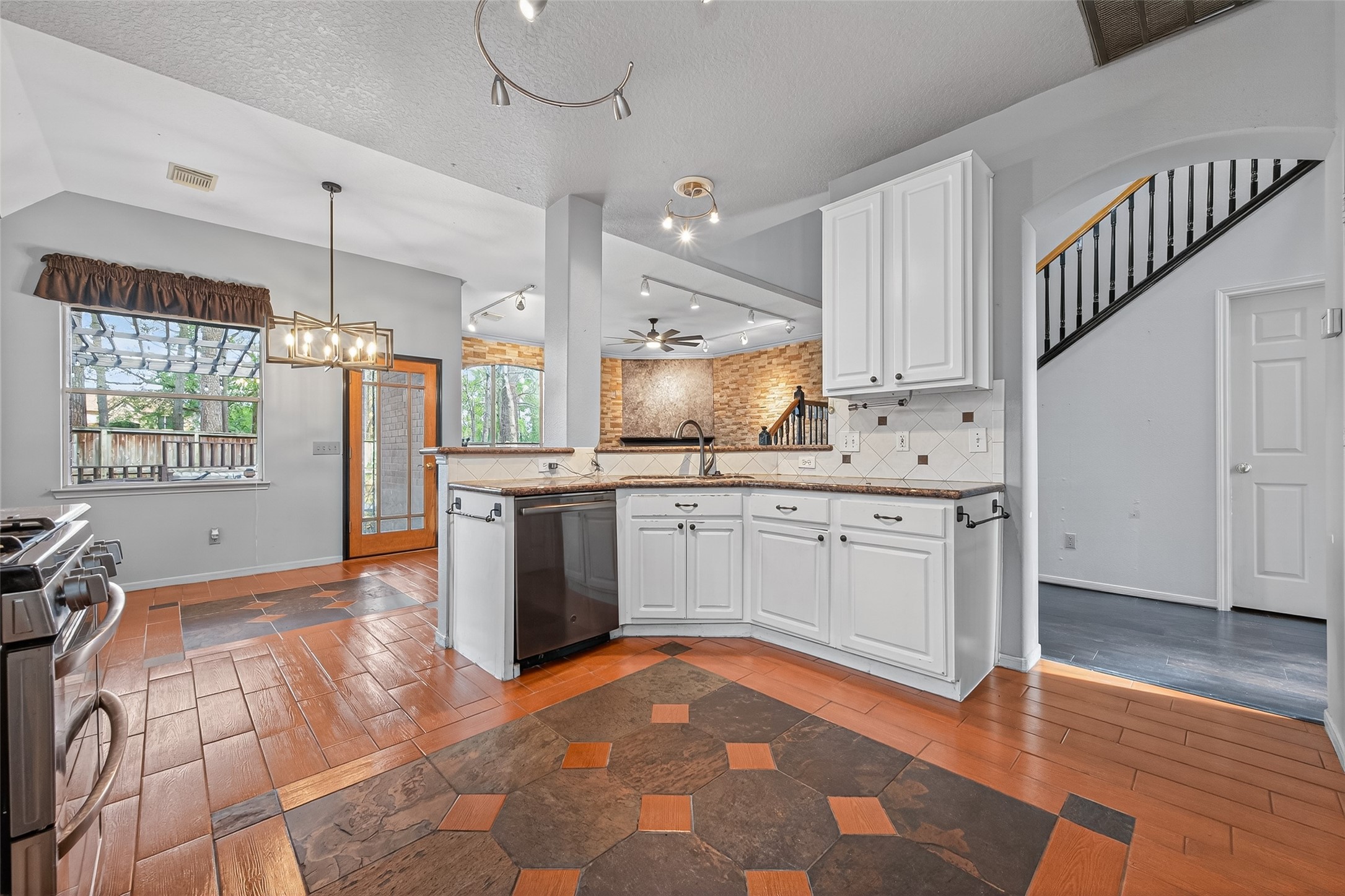 19331 Timber Tree Court Humble, TX 77346 - Photo 11 of 43 a large kitchen with kitchen island a sink stainless steel appliances and cabinets