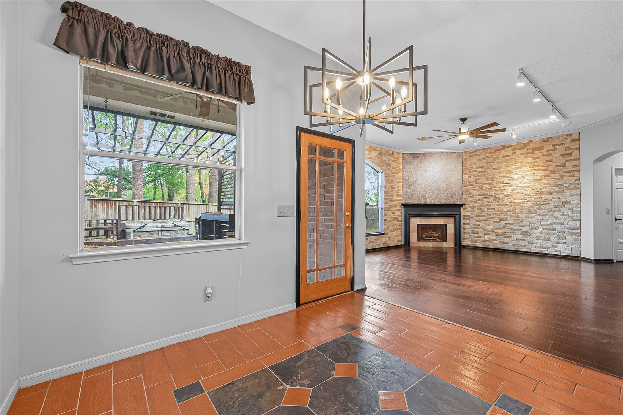 19331 Timber Tree Court Humble, TX 77346 - Photo 13 of 43 a view of an empty room with wooden floor and a window