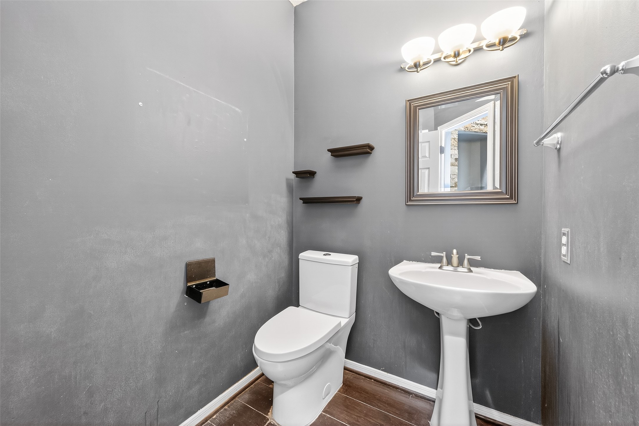 19331 Timber Tree Court Humble, TX 77346 - Photo 20 of 43 a bathroom with a sink a mirror and a toilet