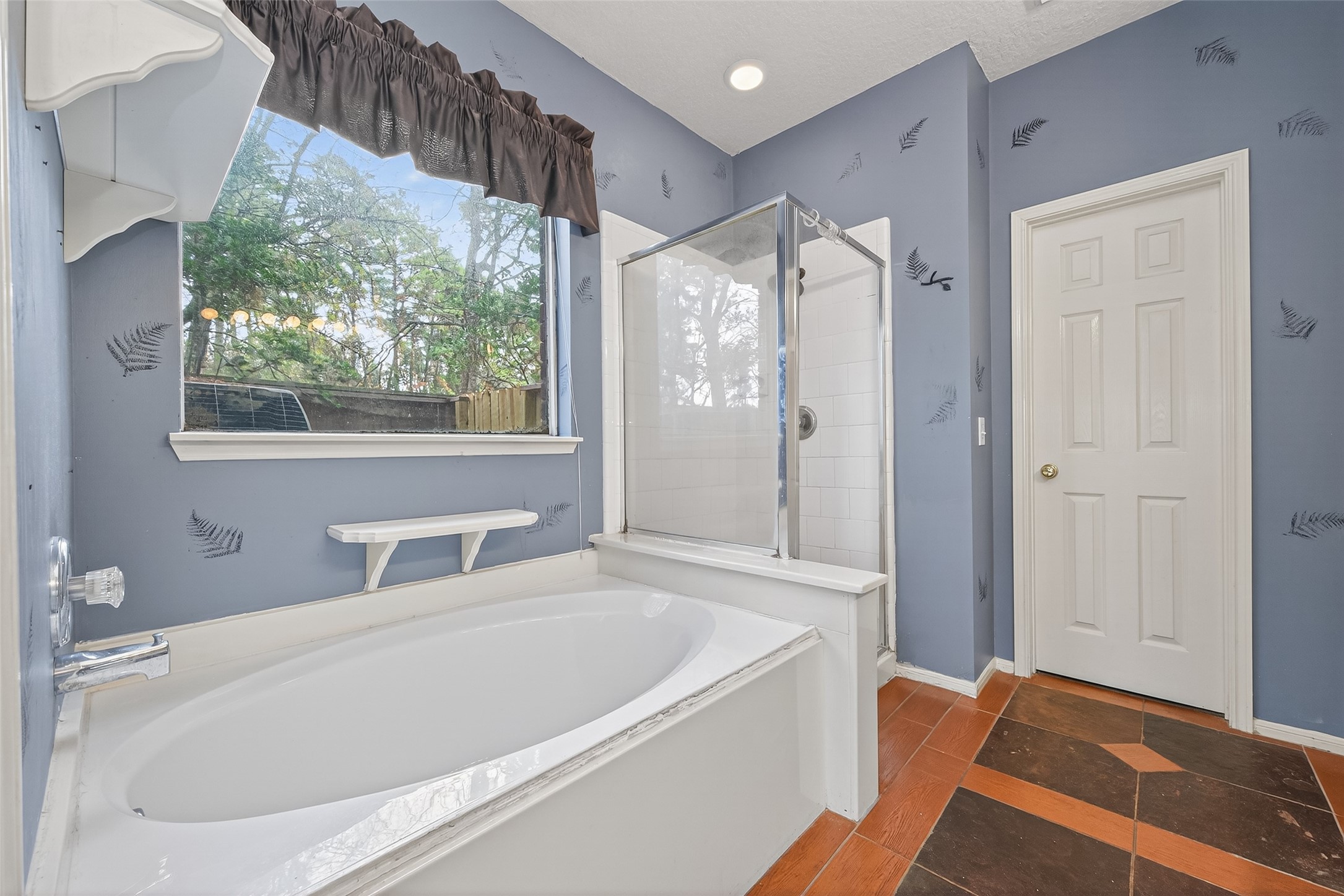 19331 Timber Tree Court Humble, TX 77346 - Photo 25 of 43 a bathroom with a tub shower and sink
