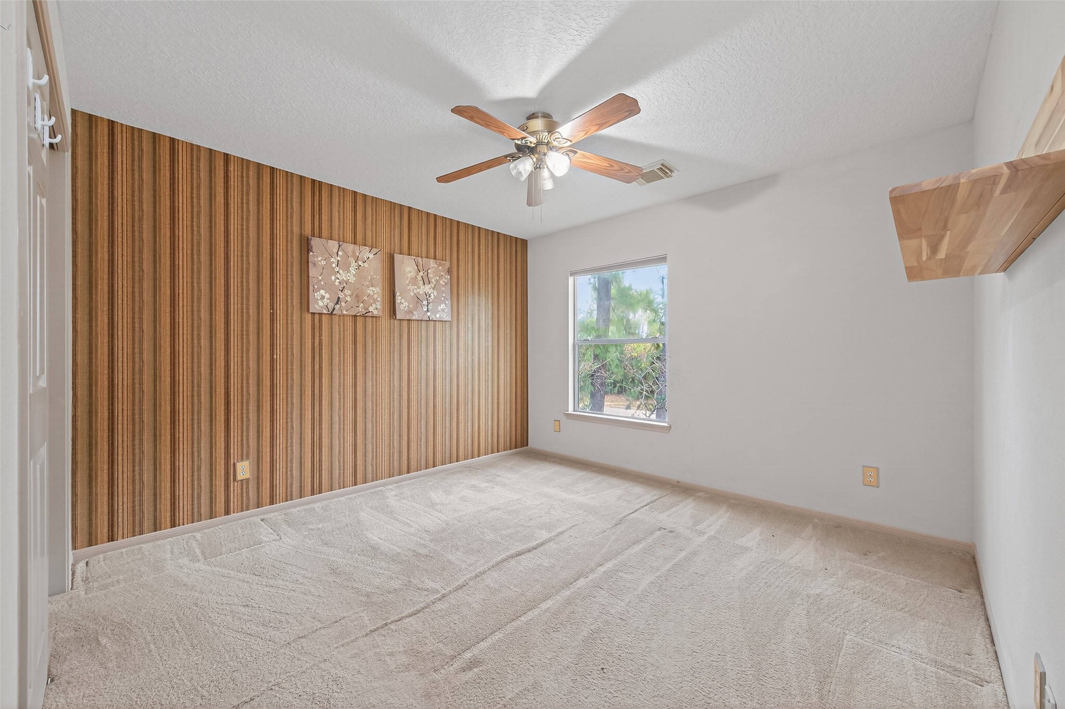 19331 Timber Tree Court Humble, TX 77346 - Photo 35 of 43 an empty room with windows and fan
