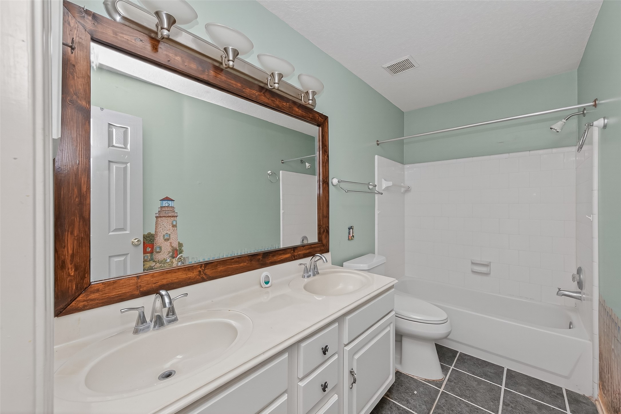 19331 Timber Tree Court Humble, TX 77346 - Photo 36 of 43 a bathroom with a granite countertop sink toilet a shower and a mirror