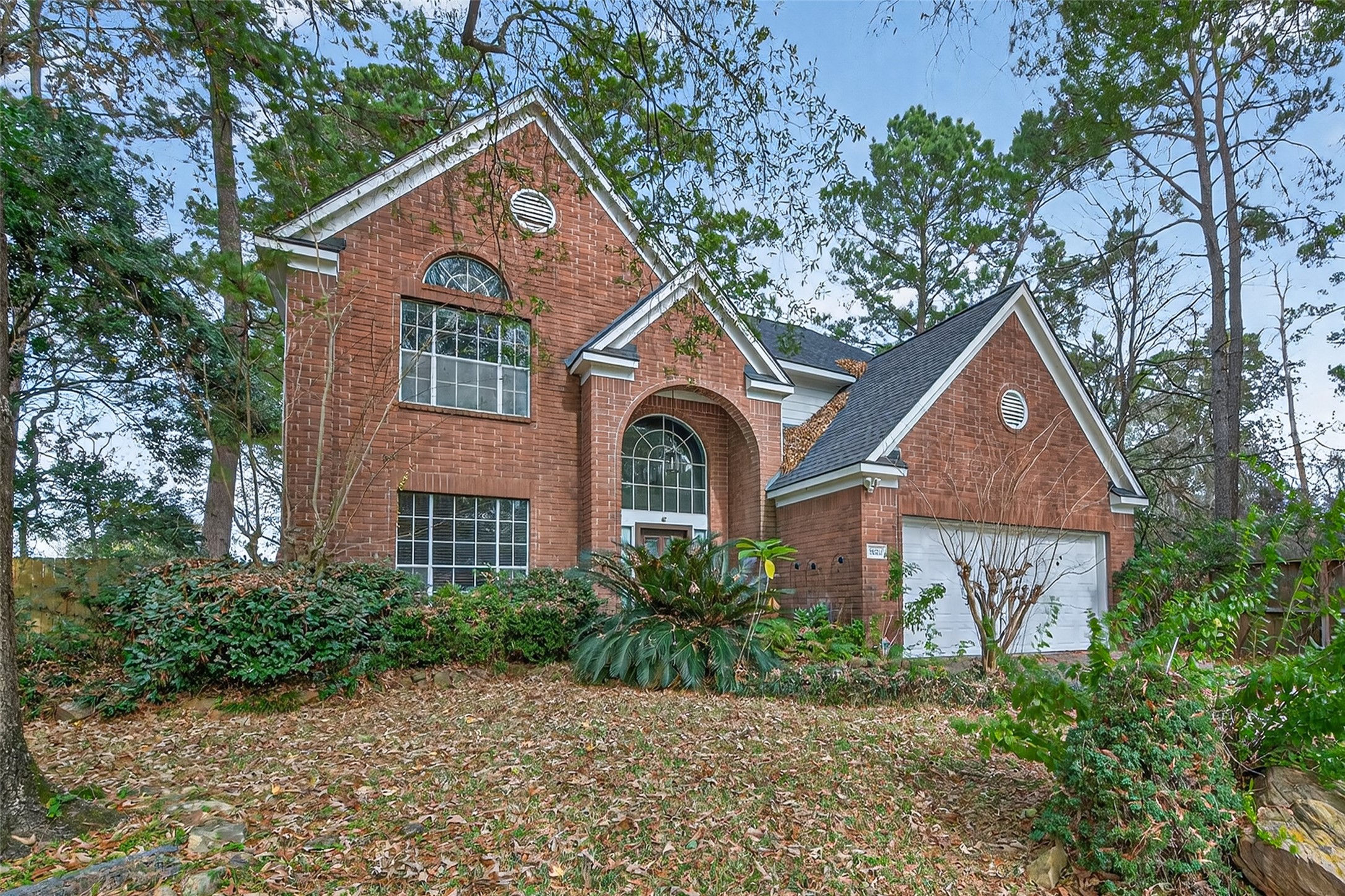 19331 Timber Tree Court Humble, TX 77346 - Photo 4 of 43 a front view of a house with garden