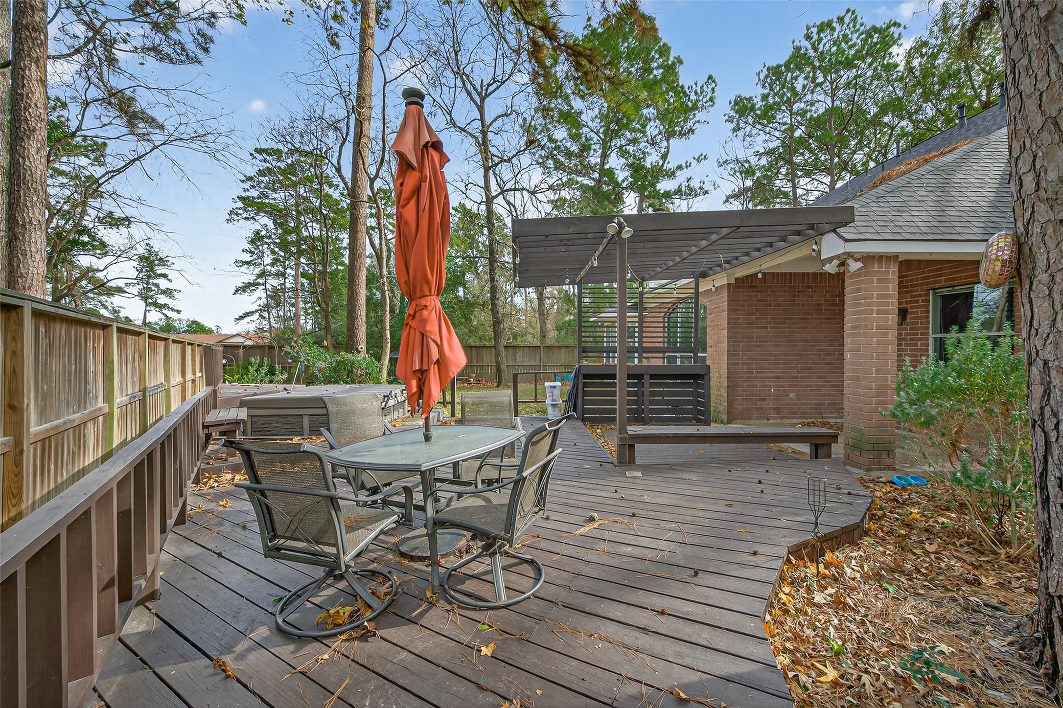19331 Timber Tree Court Humble, TX 77346 - Photo 41 of 43 a view of backyard with a table and chairs