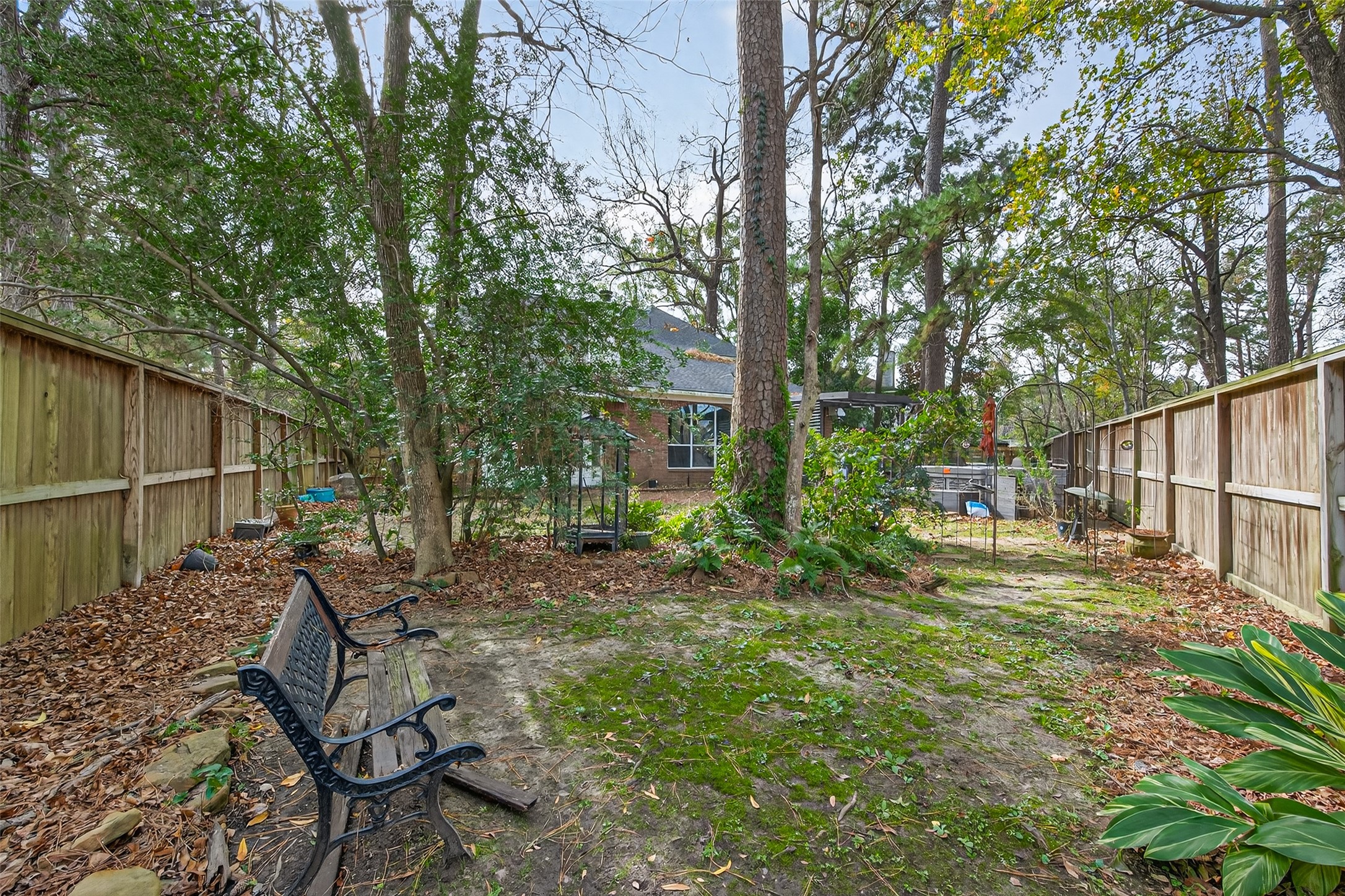 19331 Timber Tree Court Humble, TX 77346 - Photo 43 of 43 a backyard of a house with table and chairs