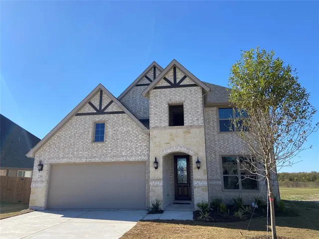 a front view of a house with yard