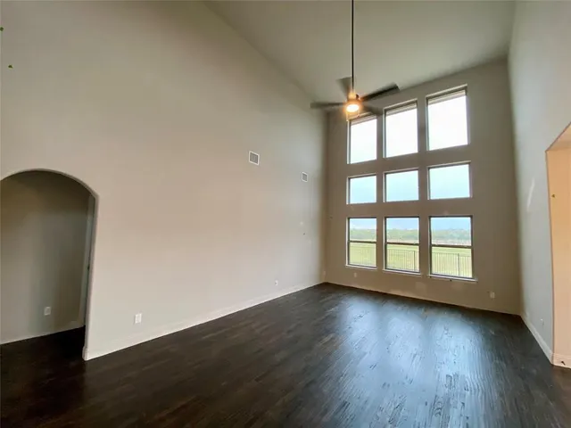 a view of room with window and wooden floor
