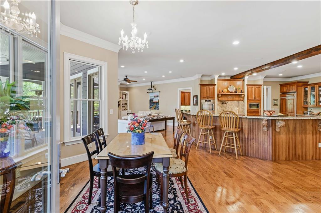 62 Cedar Trail Commerce, GA 30529 - Photo 20 of 115 a view of a dining room with furniture and wooden floor