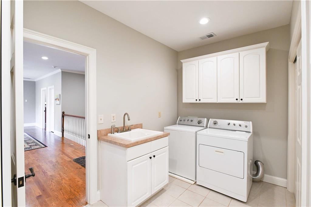 62 Cedar Trail Commerce, GA 30529 - Photo 67 of 115 a utility room with cabinets washer and dryer