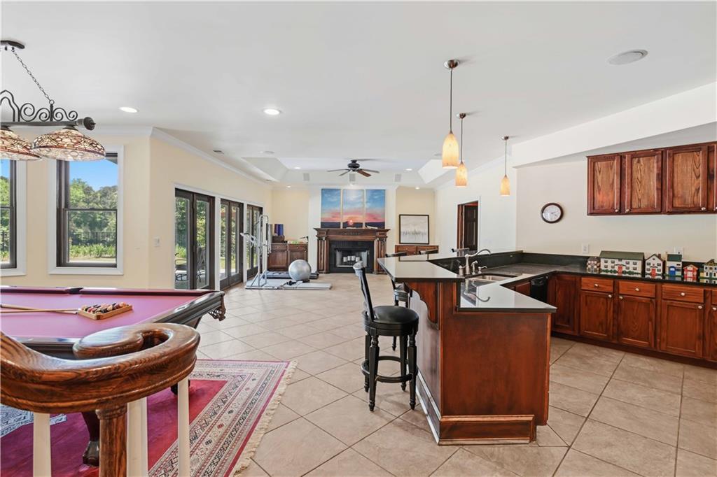 62 Cedar Trail Commerce, GA 30529 - Photo 69 of 115 a kitchen with stainless steel appliances granite countertop a stove a sink dishwasher and a dining table with the kitchen view