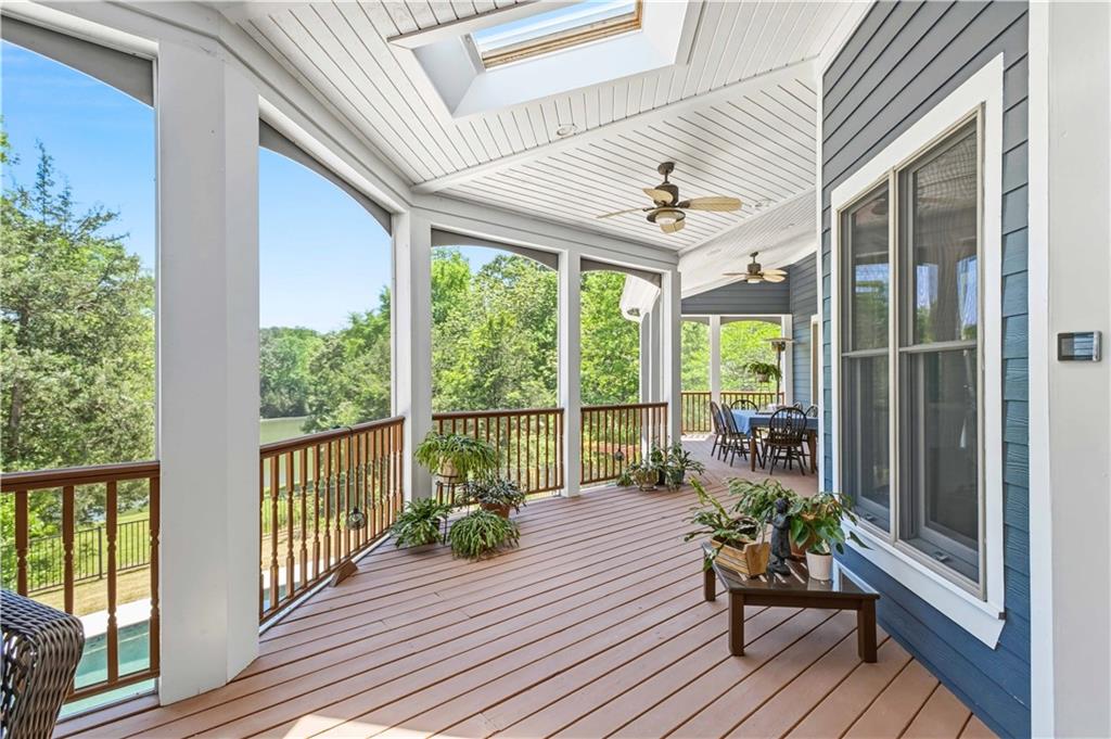 62 Cedar Trail Commerce, GA 30529 - Photo 90 of 115 a view of a balcony with chairs and wooden floor