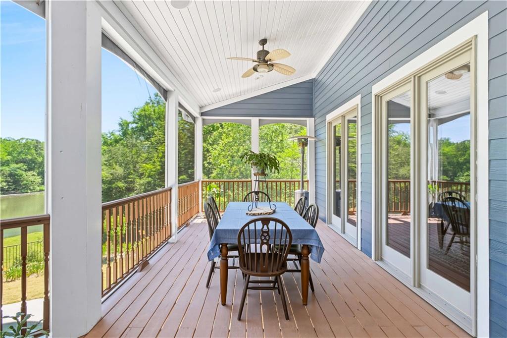 62 Cedar Trail Commerce, GA 30529 - Photo 91 of 115 a view of a dining room with furniture window and wooden floor