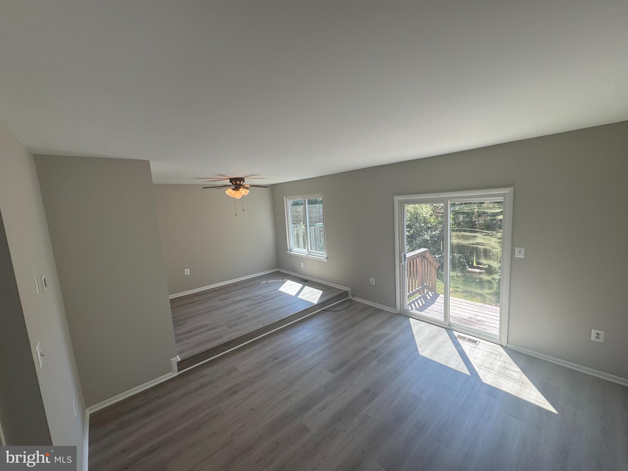 8958 Centerway Road Gaithersburg, MD 20879 - Photo 12 of 37 wooden floor in an empty room with a window