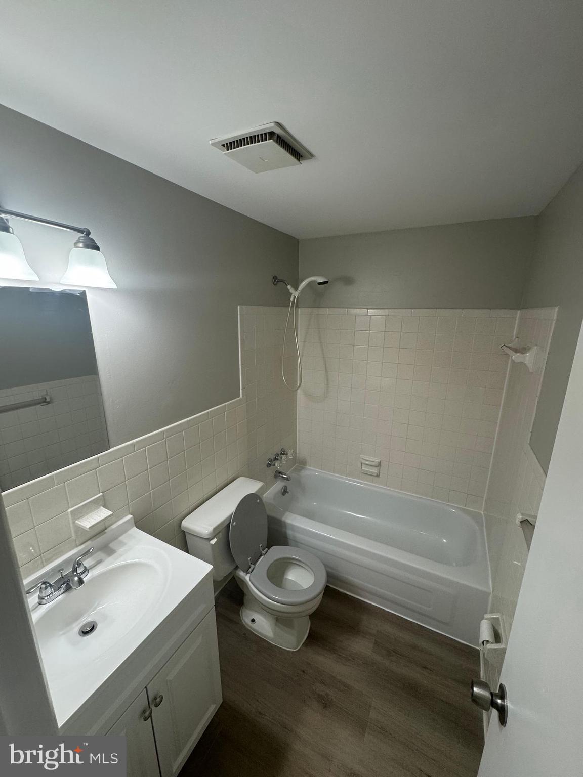 8958 Centerway Road Gaithersburg, MD 20879 - Photo 28 of 37 a bathroom with a sink a toilet and shower