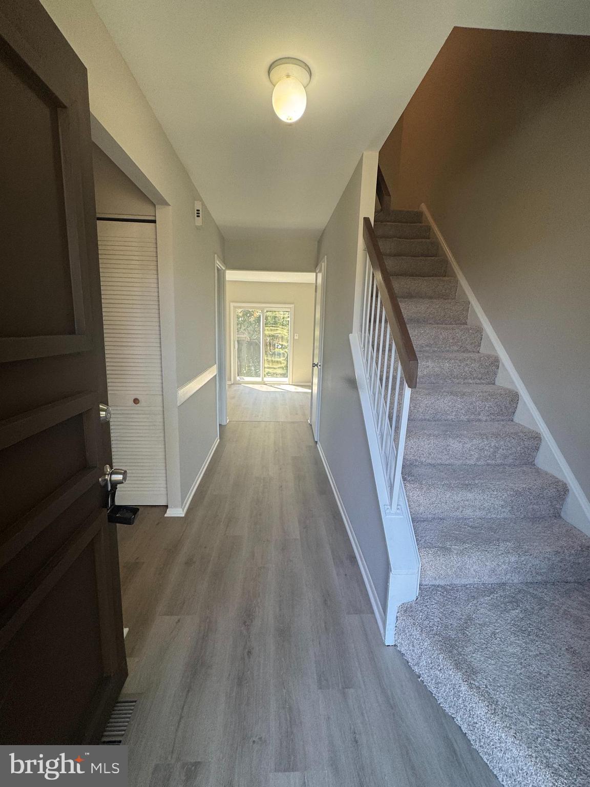 8958 Centerway Road Gaithersburg, MD 20879 - Photo 5 of 37 a view of entryway with wooden floor