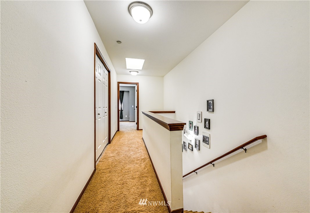 21334 11th Drive Southeast Bothell, WA 98021 - Photo 14 of 29 a view of a hallway with the white walls