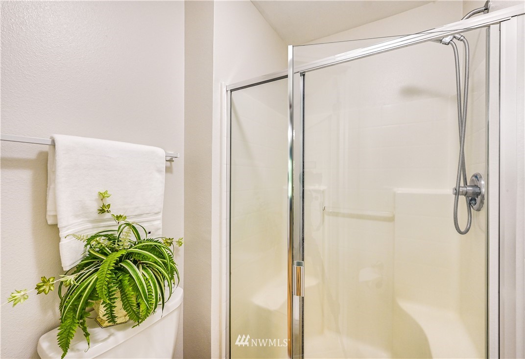 21334 11th Drive Southeast Bothell, WA 98021 - Photo 19 of 29 a bathroom with a shower and a glass window