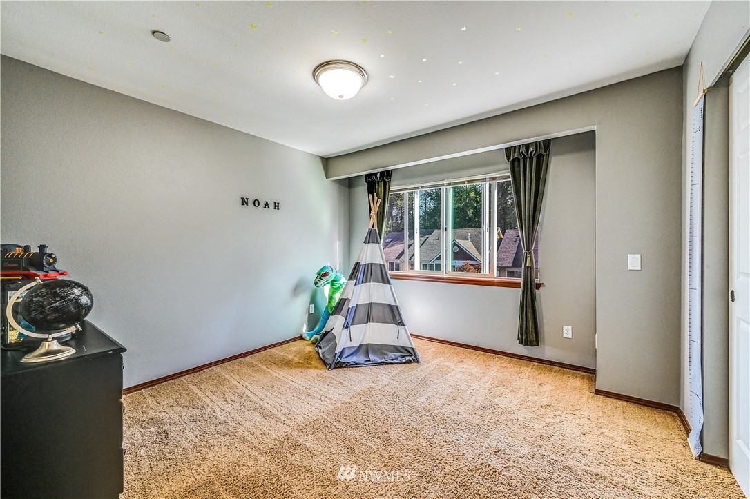 21334 11th Drive Southeast Bothell, WA 98021 - Photo 20 of 29 a room with furniture and window