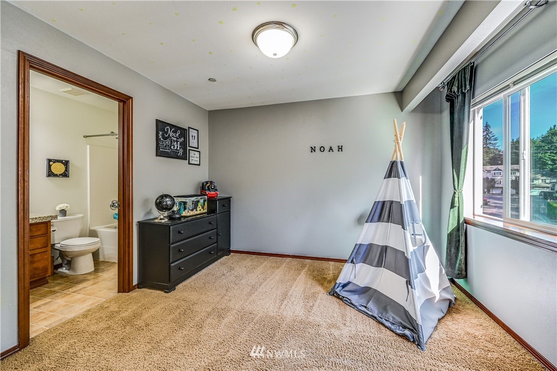 21334 11th Drive Southeast Bothell, WA 98021 - Photo 21 of 29 a bedroom with a bed and a couch
