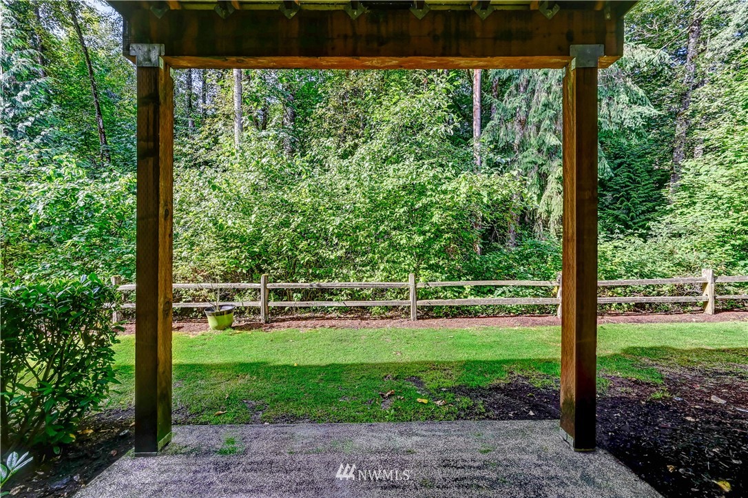 21334 11th Drive Southeast Bothell, WA 98021 - Photo 26 of 29 a view of a backyard with plants and garden