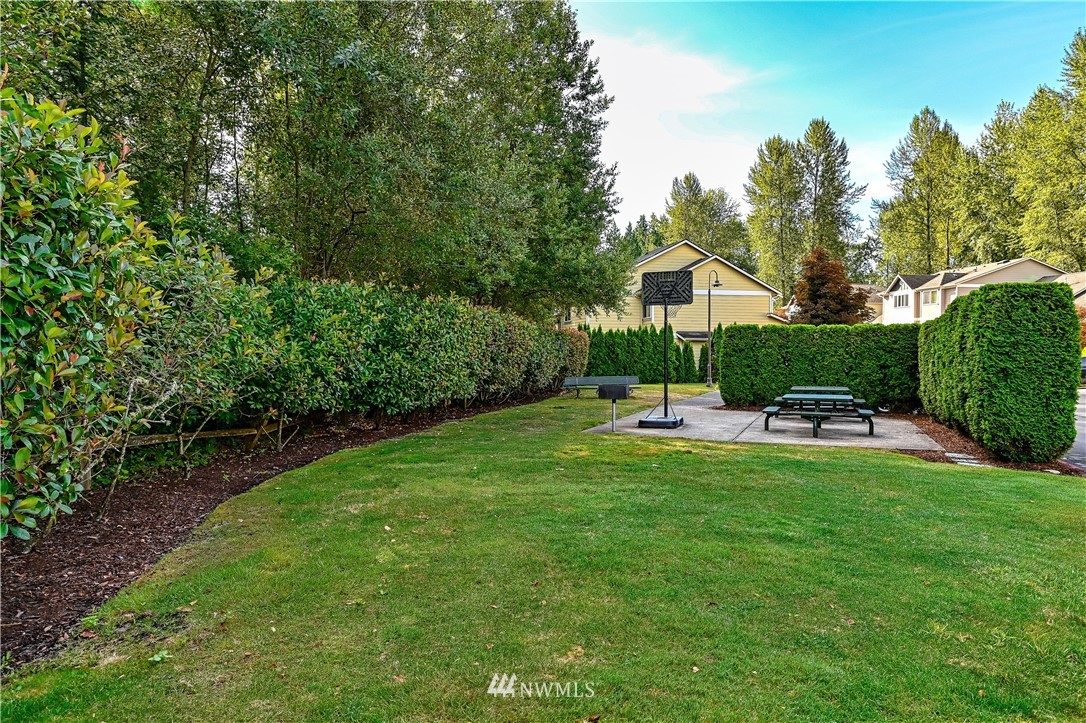 21334 11th Drive Southeast Bothell, WA 98021 - Photo 28 of 29 a view of a house with a yard patio and swimming pool
